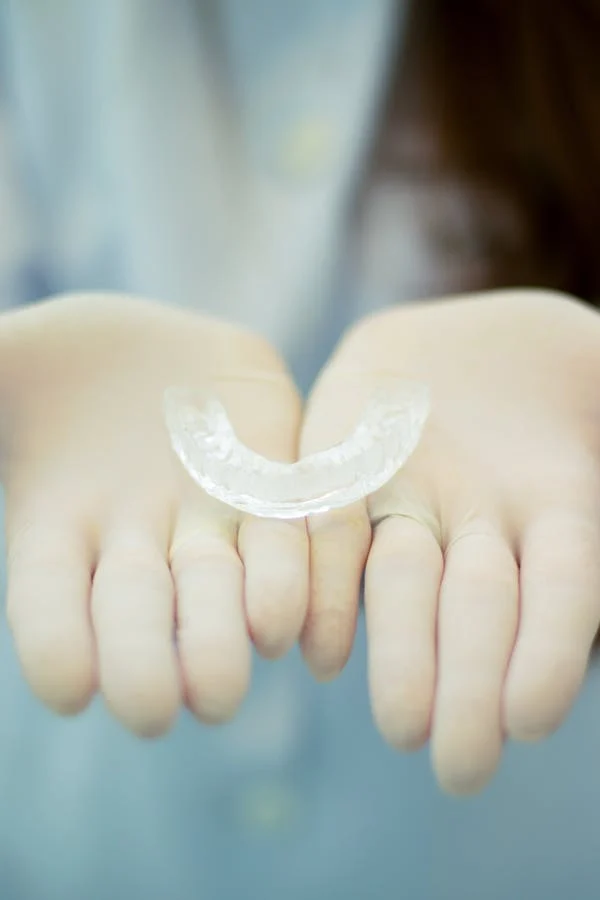 a dentist showing an invisalign 