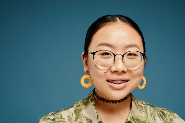 studio shot of a woman with braces