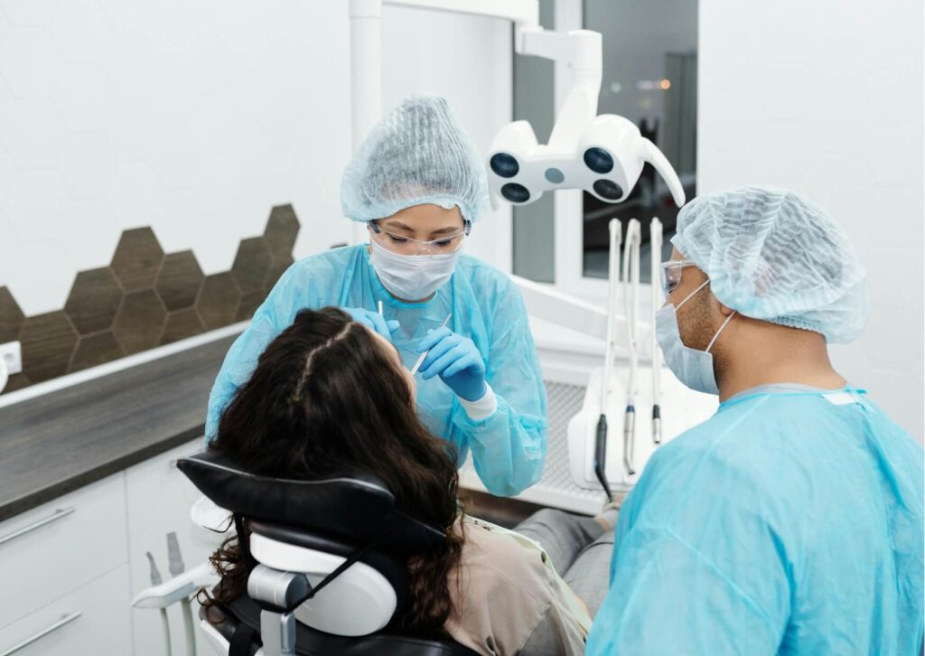 Adult patient consulting with an orthodontic team about braces, showing that adults can get braces to improve alignment and bite.