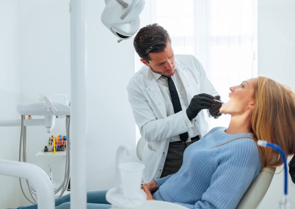 Orthodontic consultation with an adult patient discussing Damon braces treatment timeline and expected results.