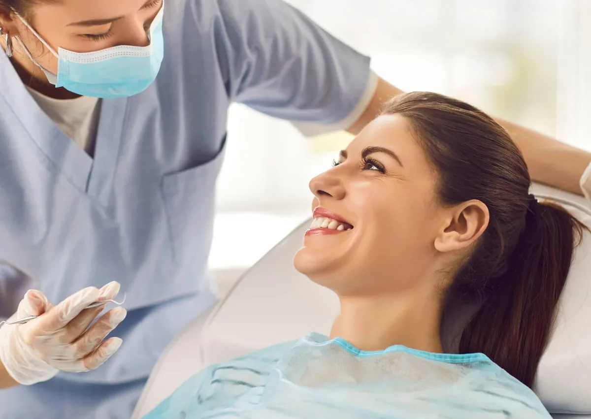 Patient discussing clear ceramic braces cost and treatment options with a dental professional.